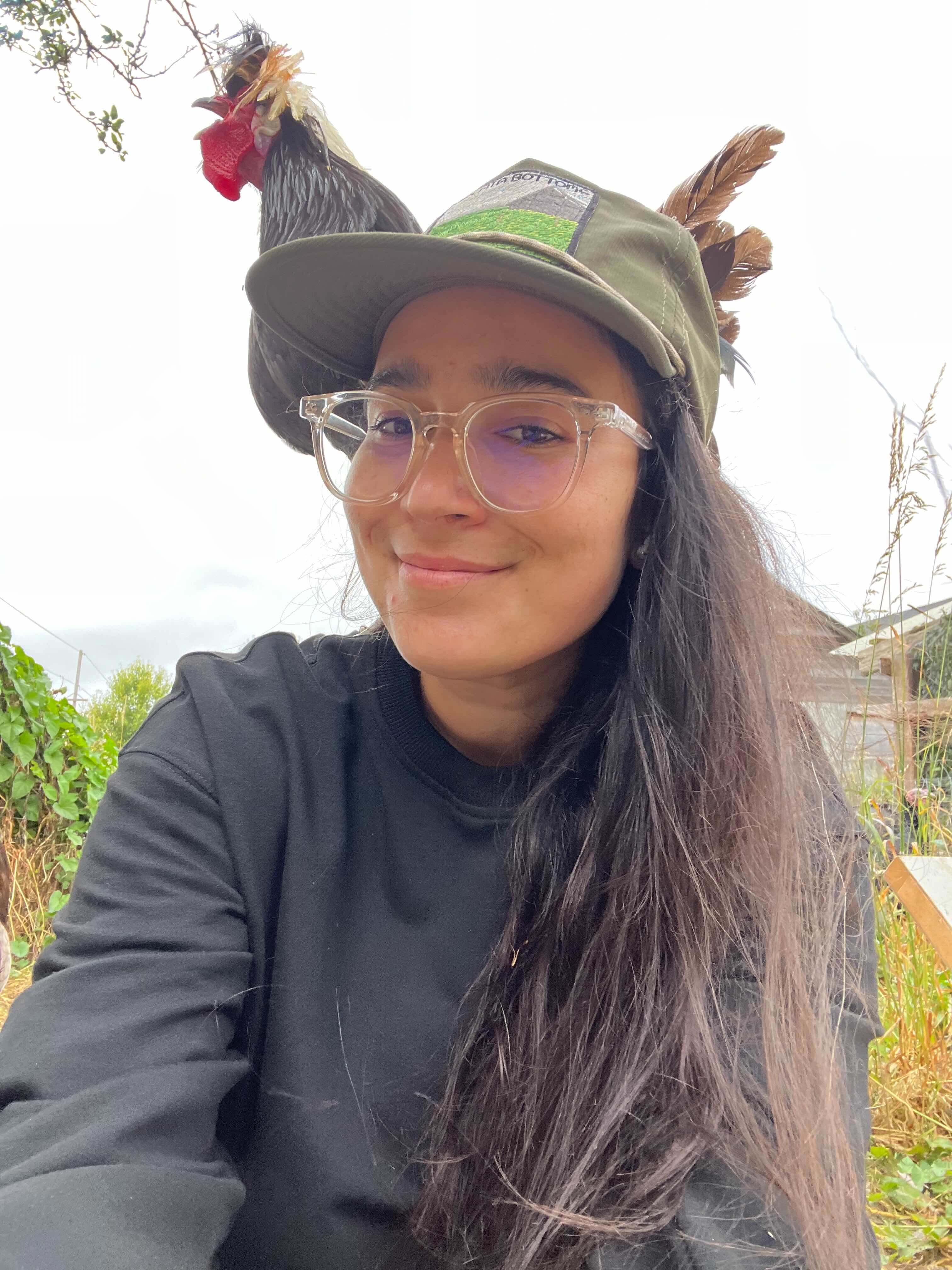 A woman and a rooster.