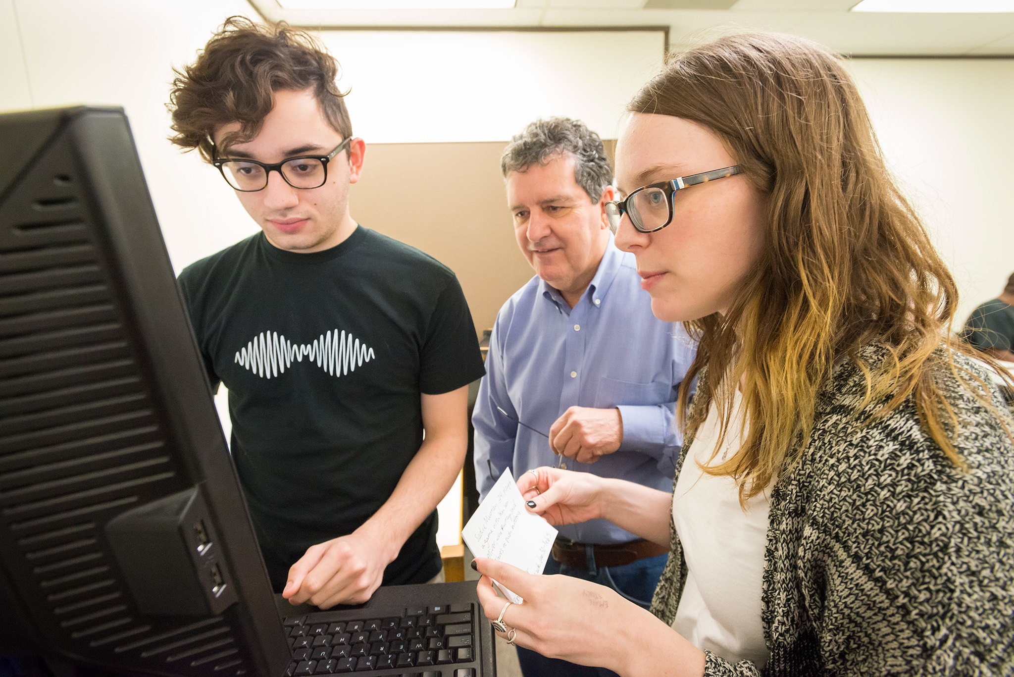 students looking at a computer