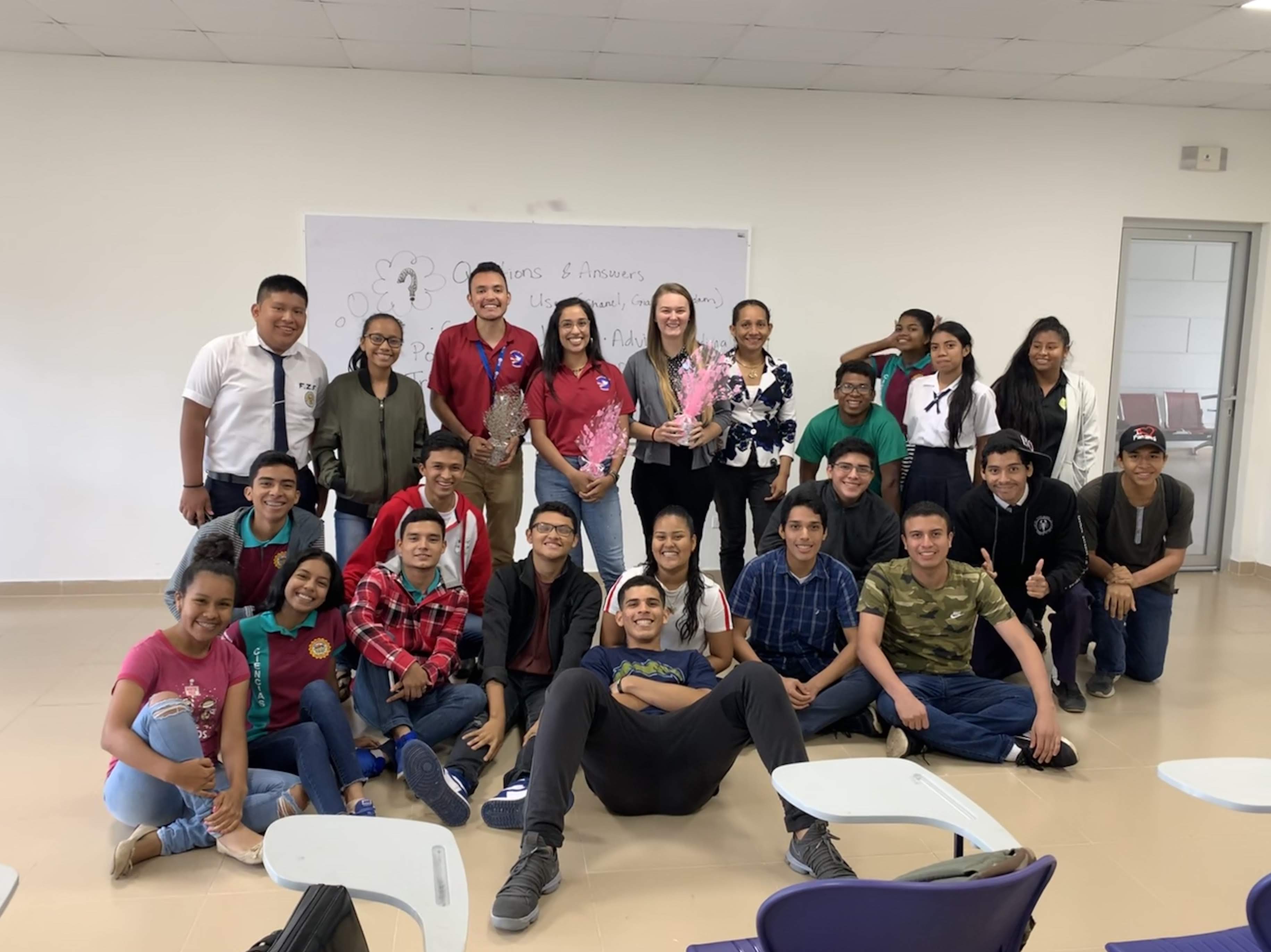 Chanel and other Peace Corps Volunteers along with High School Juniors and Seniors