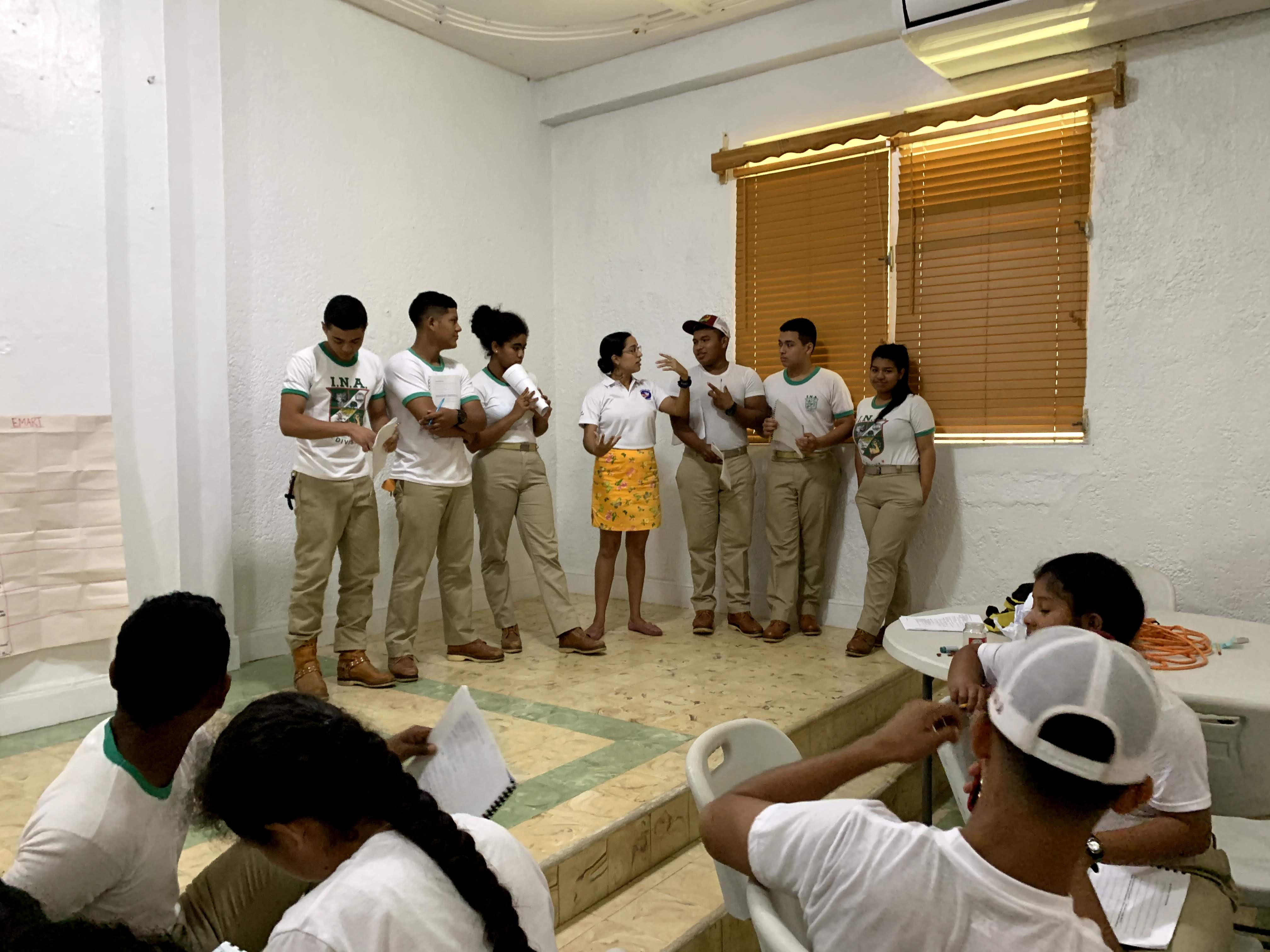 Chanel and a few other Peace Corps volunteers leading students in professional development.
