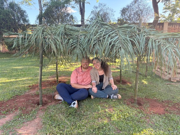Lee and his partner Delaney sit in the shade.
