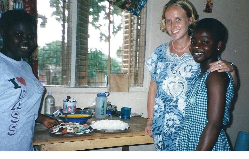Lura and two locals share a meal.