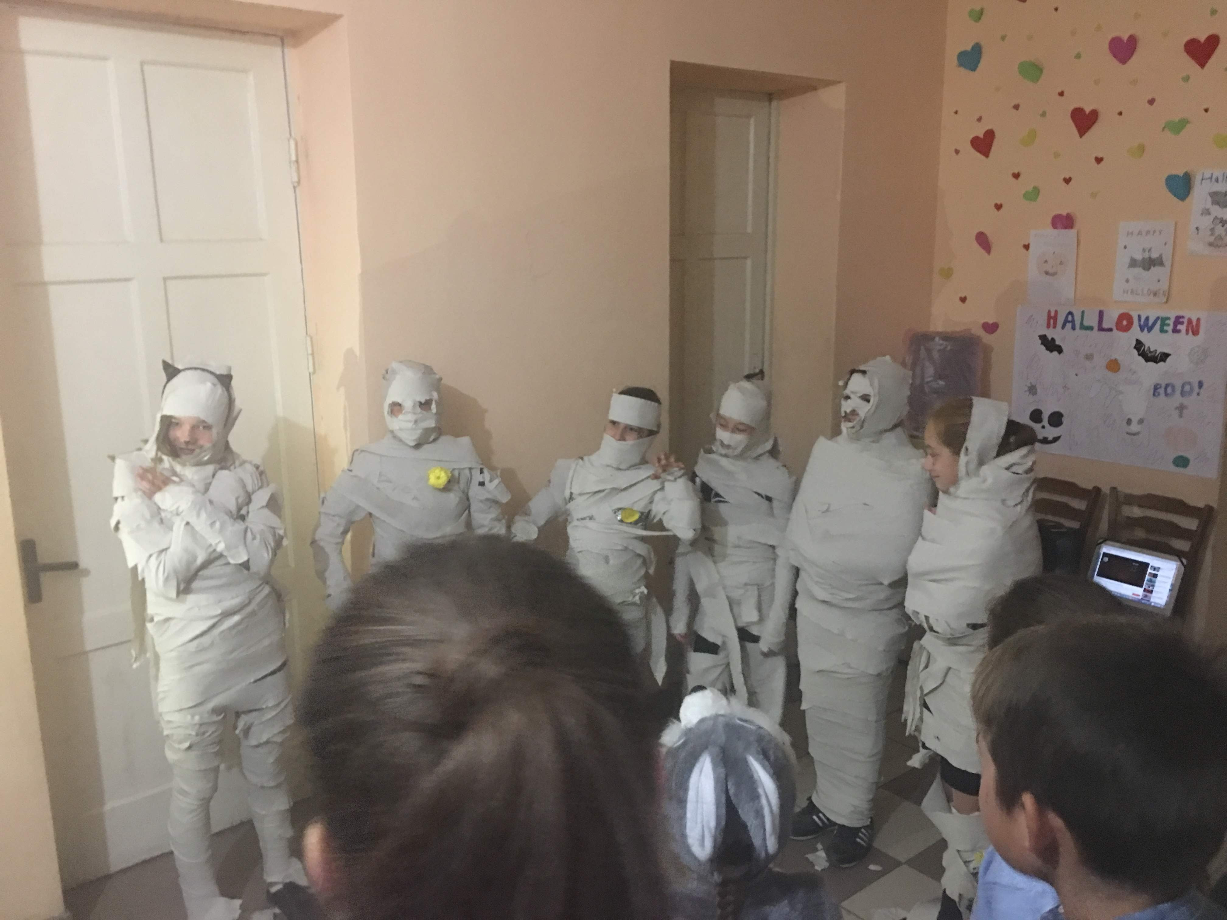 A group of Moldovan children dress as mummies for Halloween