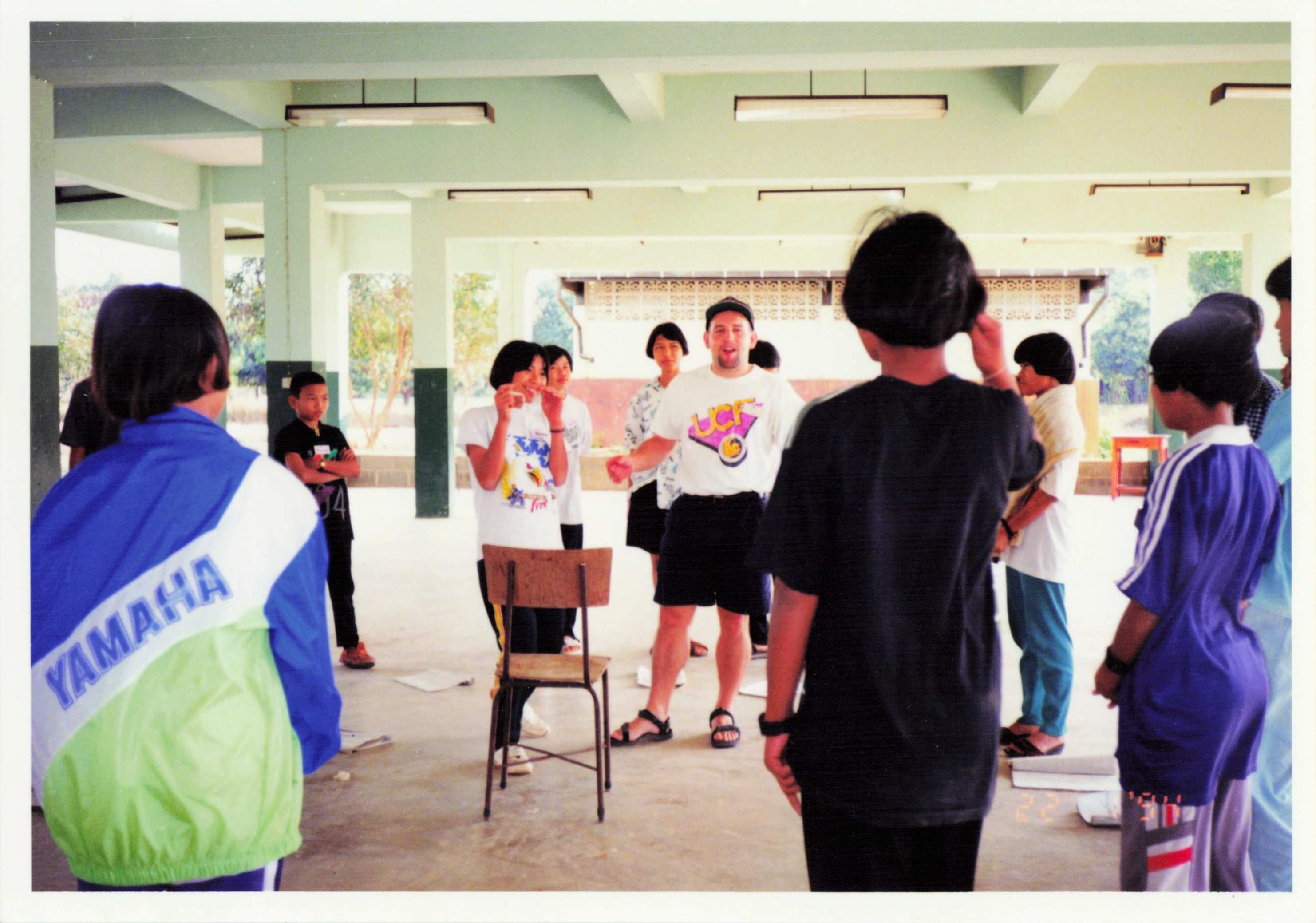 Peace Corps Volunteer Matthew, surrounded by teachers at the English camp.